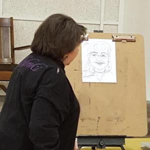 Nancy Mathis teaches caricature drawing.